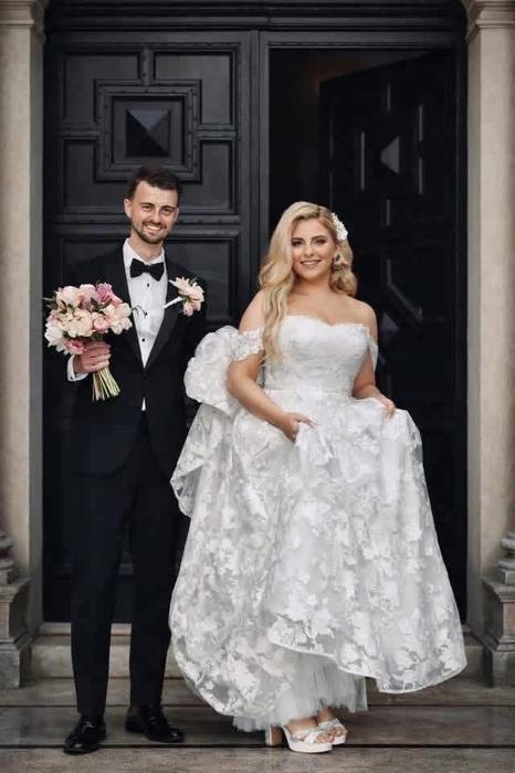 Wedding couple portrait outside a doorway