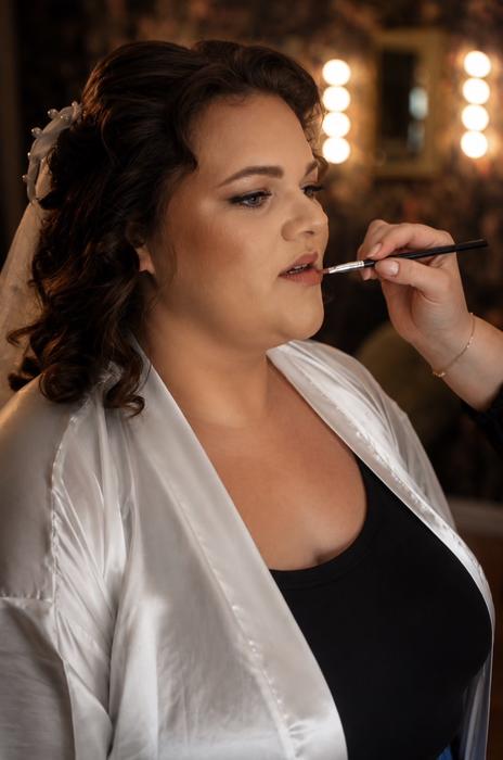Bride makeup preparation moment