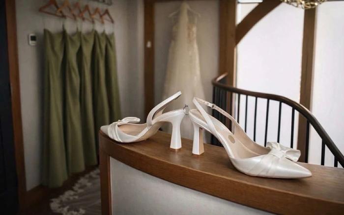 Wedding shoes detail on a window ledge