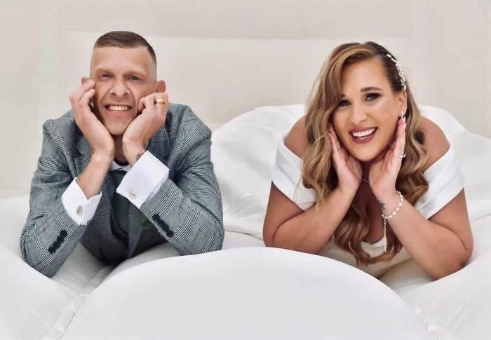 Wedding couple smiling together in a bright portrait